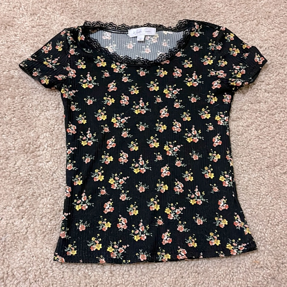 Tight shirt with flowers.